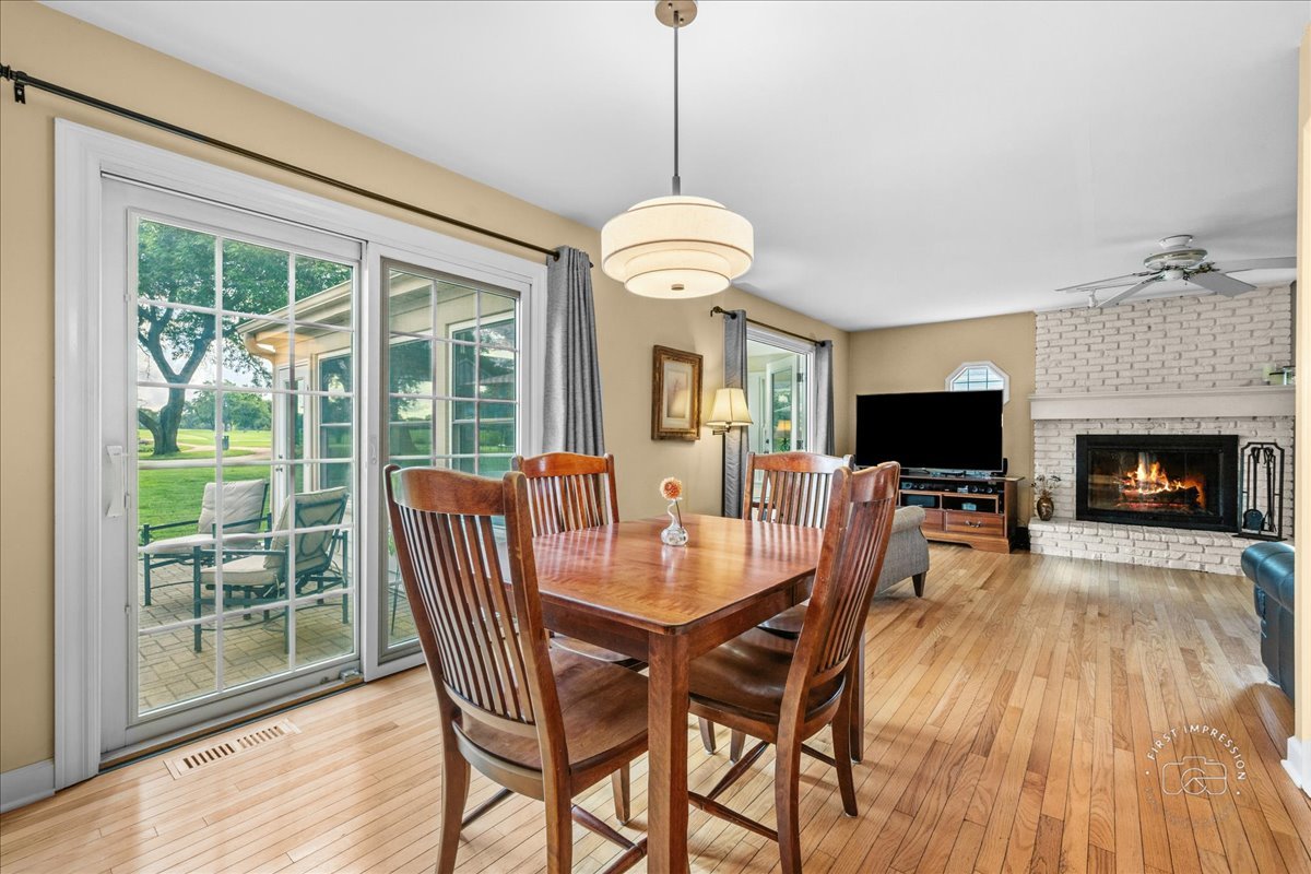 1432 Calcutta Lane Naperville, IL 60563 - Photo 11 of 43 a view of a dining room with furniture window and wooden floor