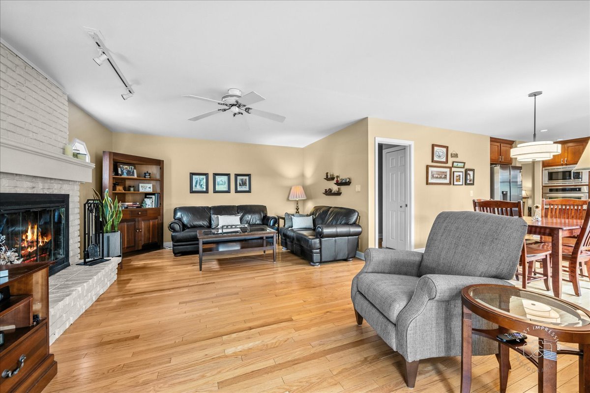 1432 Calcutta Lane Naperville, IL 60563 - Photo 18 of 43 a living room with furniture and a fireplace