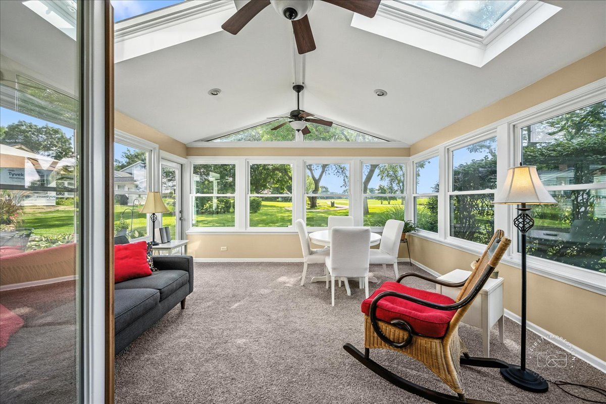 1432 Calcutta Lane Naperville, IL 60563 - Photo 19 of 43 a living room with furniture and floor to ceiling windows