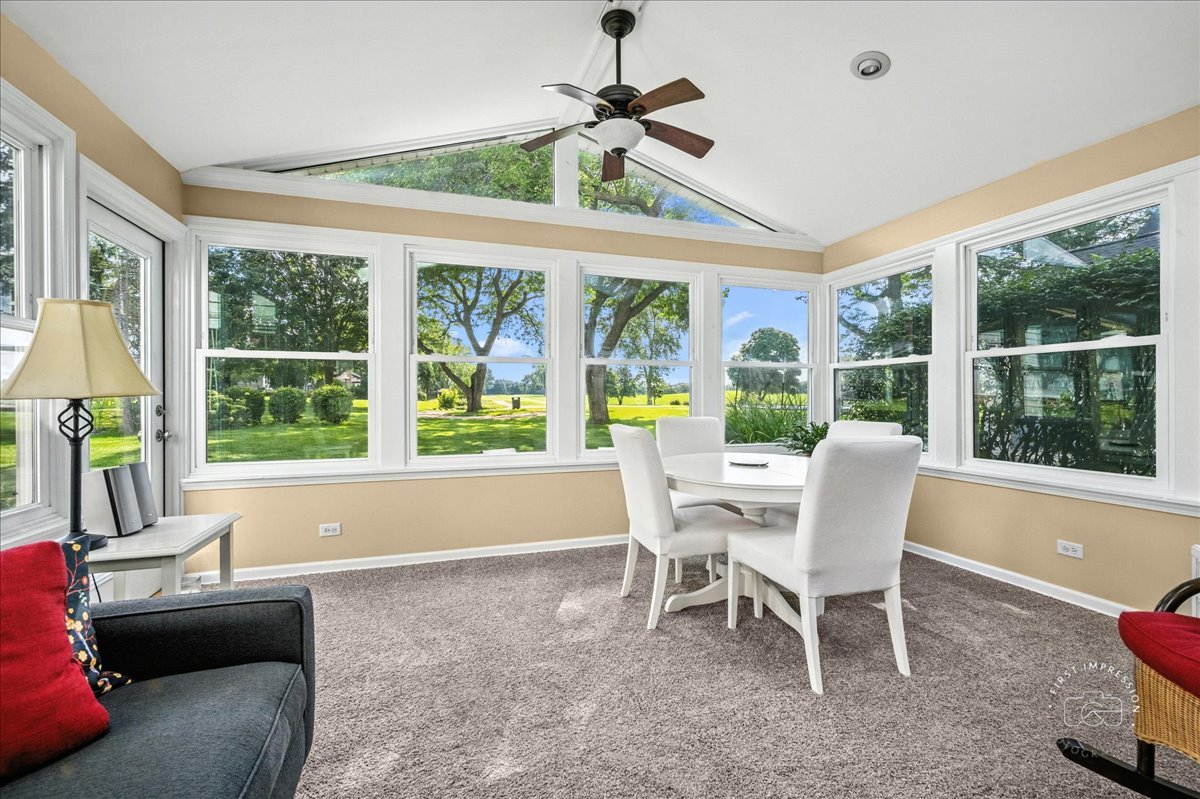 1432 Calcutta Lane Naperville, IL 60563 - Photo 20 of 43 a dining room with furniture a chandelier and wooden floor