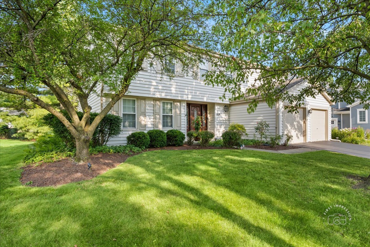 1432 Calcutta Lane Naperville, IL 60563 - Photo 2 of 43 a front view of a house with a yard