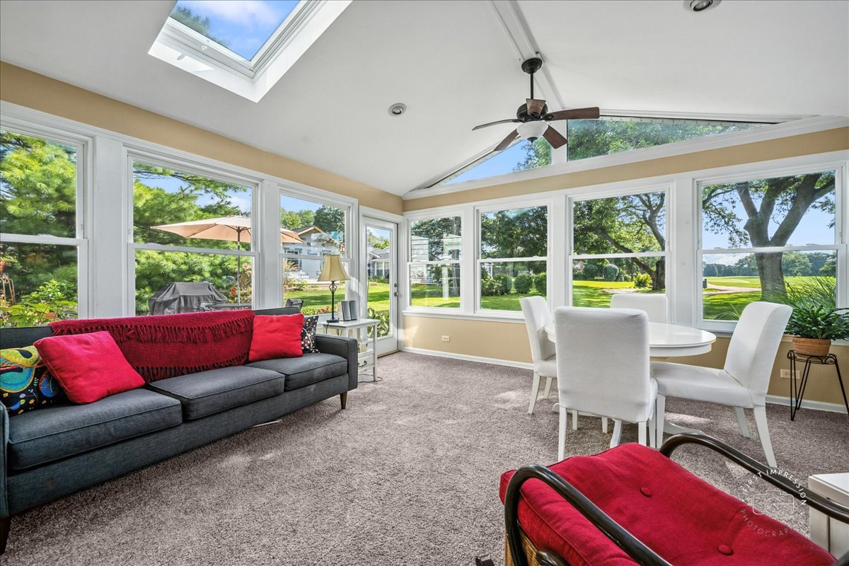 1432 Calcutta Lane Naperville, IL 60563 - Photo 21 of 43 a living room with furniture and a large window
