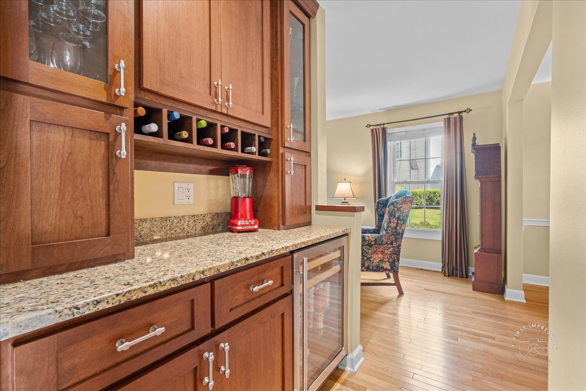 1432 Calcutta Lane Naperville, IL 60563 - Photo 24 of 43 a kitchen with stainless steel appliances granite countertop a sink and cabinets