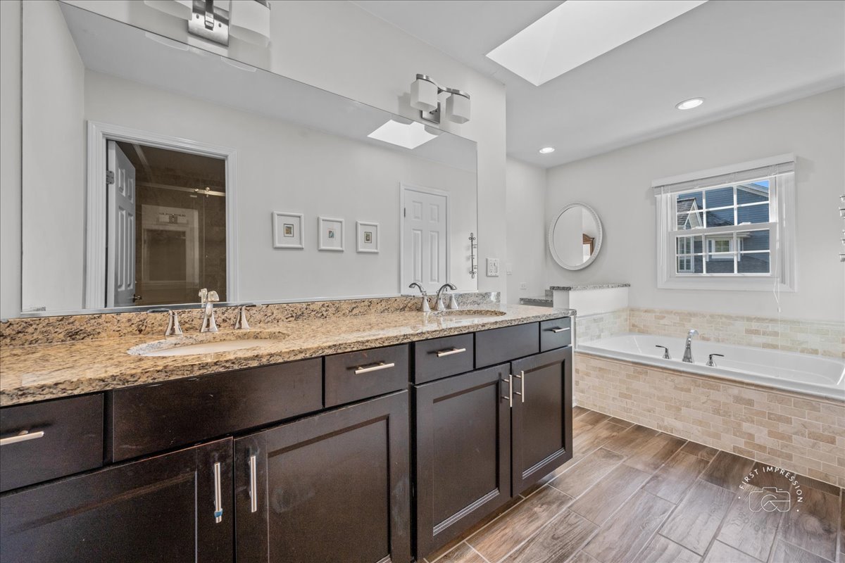 1432 Calcutta Lane Naperville, IL 60563 - Photo 29 of 43 a bathroom with a granite countertop sink mirror and a