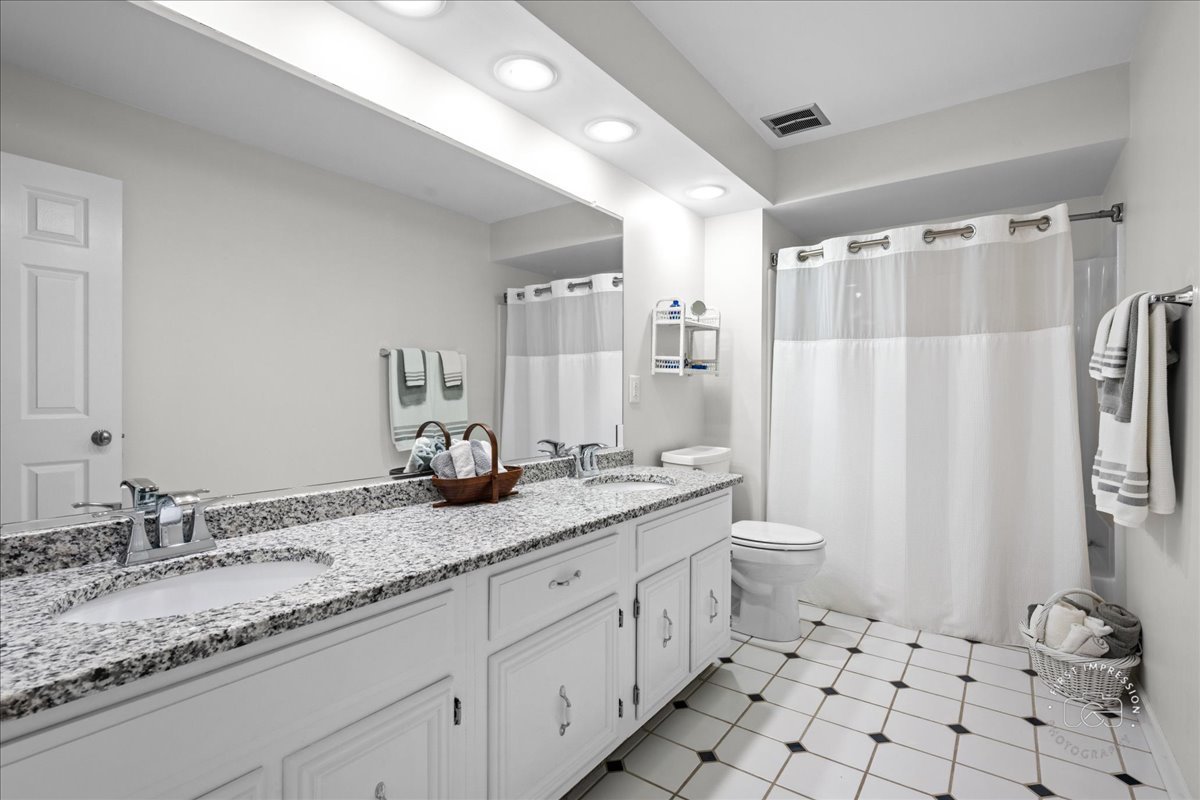 1432 Calcutta Lane Naperville, IL 60563 - Photo 34 of 43 a bathroom with a granite countertop sink toilet and shower