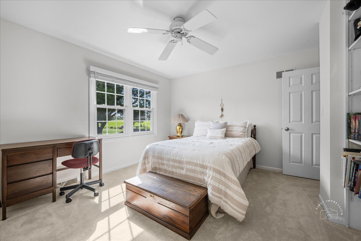 1432 Calcutta Lane Naperville, IL 60563 - Photo 35 of 43 a bedroom with a bed dresser and a window