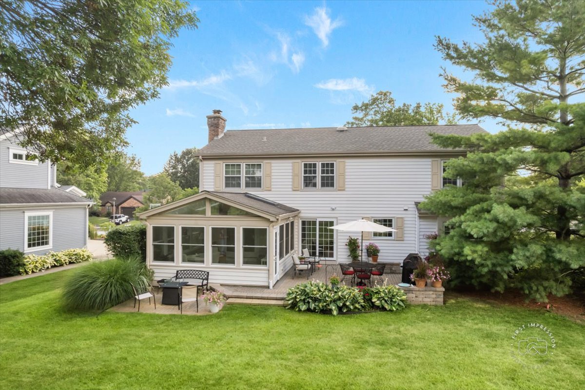 1432 Calcutta Lane Naperville, IL 60563 - Photo 40 of 43 a front view of a house with a yard table and chairs