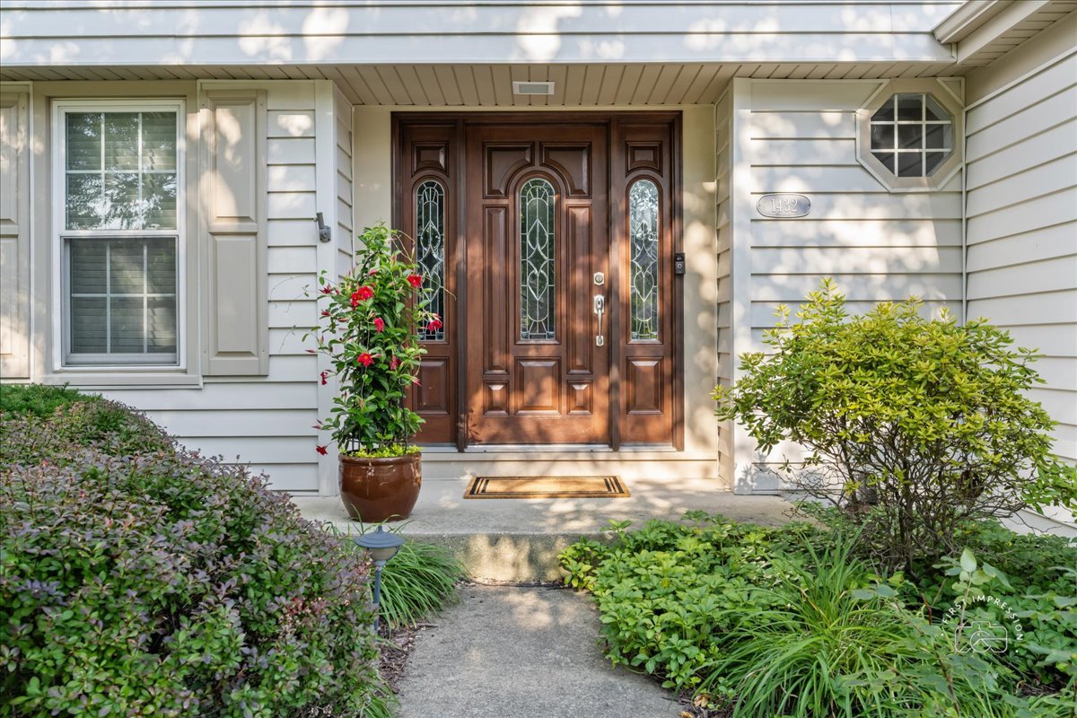 1432 Calcutta Lane Naperville, IL 60563 - Photo 6 of 43 a front view of a house with a porch