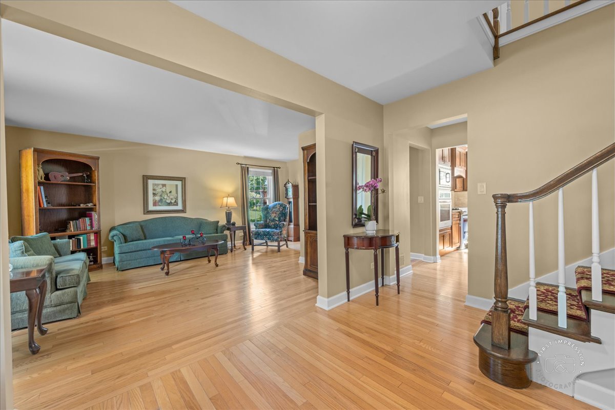 1432 Calcutta Lane Naperville, IL 60563 - Photo 7 of 43 a living room with furniture and wooden floor