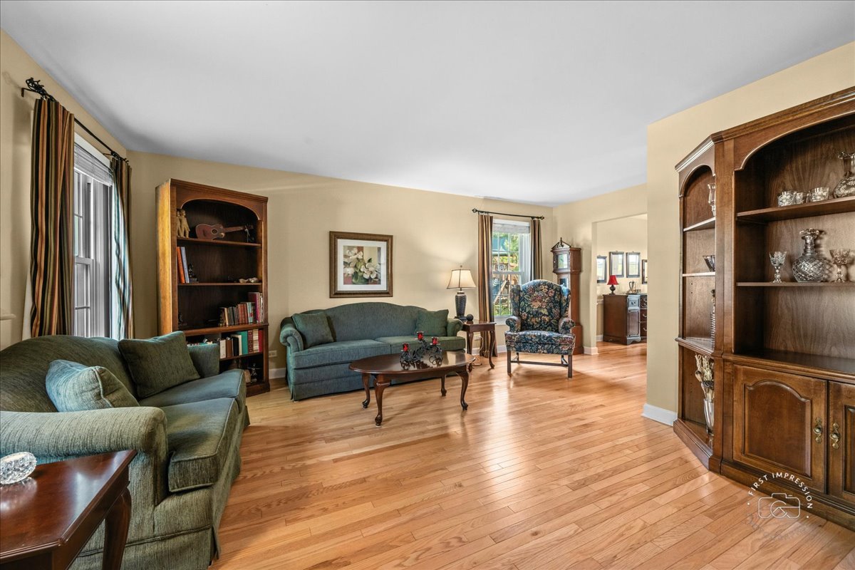 1432 Calcutta Lane Naperville, IL 60563 - Photo 8 of 43 a living room with furniture wooden floor and a flat screen tv