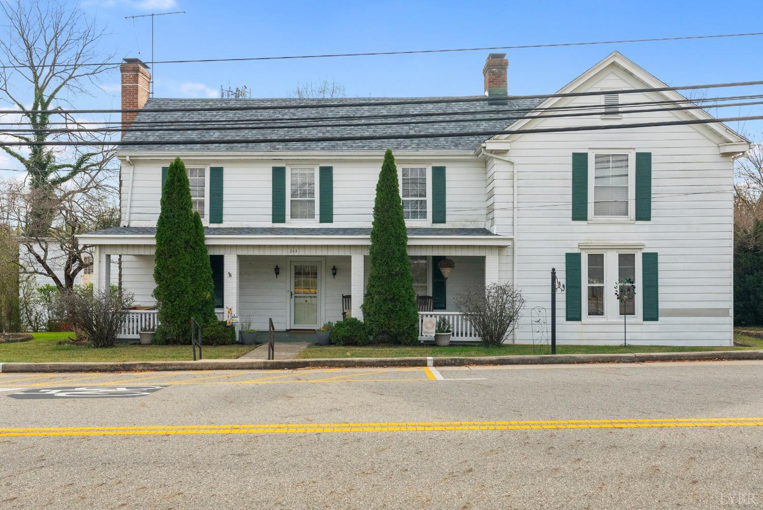 243 South Main Street Amherst, VA 24521 - Photo 2 of 57 a front view of a house with a yard