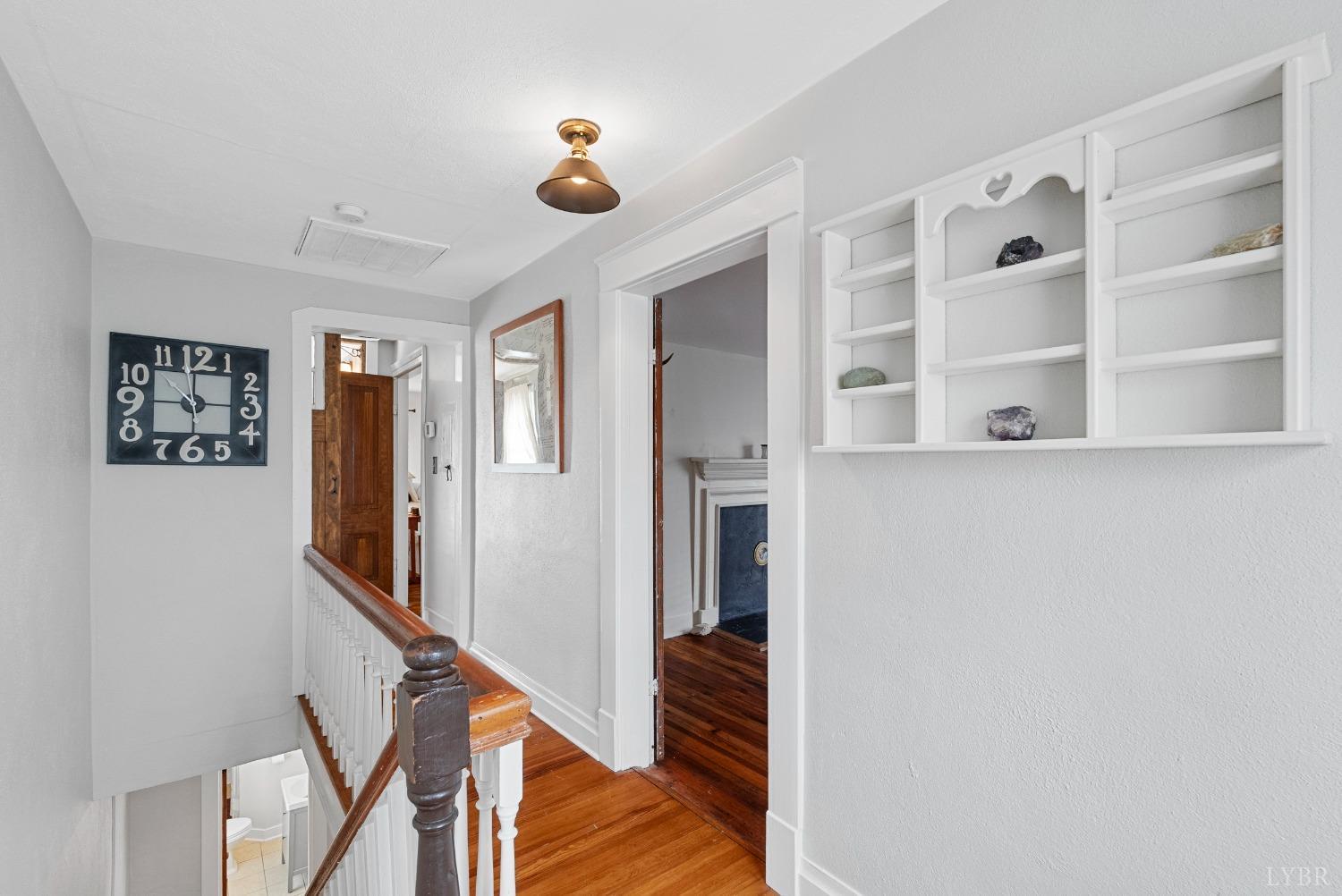 243 South Main Street Amherst, VA 24521 - Photo 28 of 57 a view of a hallway with wooden floor and staircase