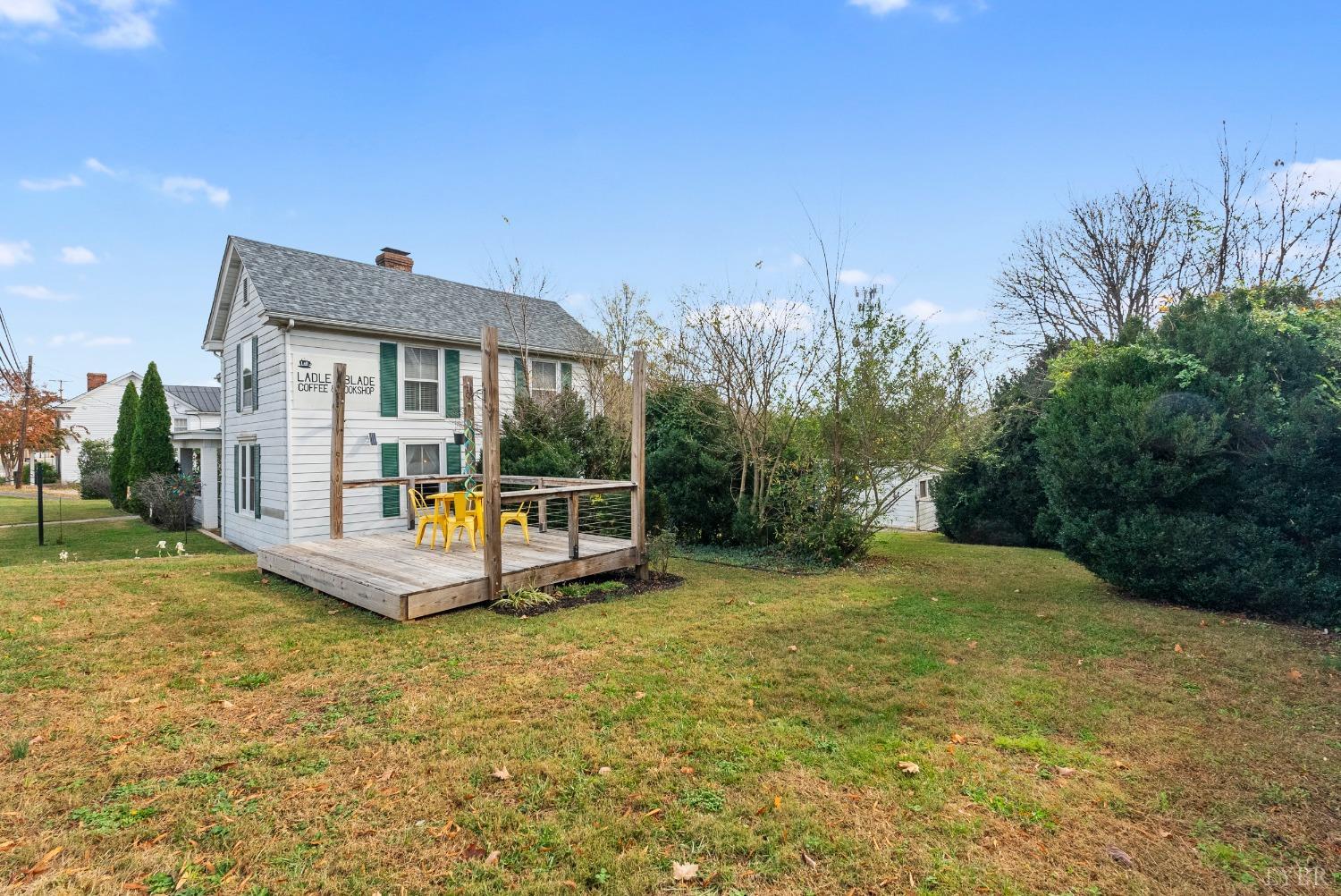 243 South Main Street Amherst, VA 24521 - Photo 4 of 57 a view of a house with backyard and sitting area