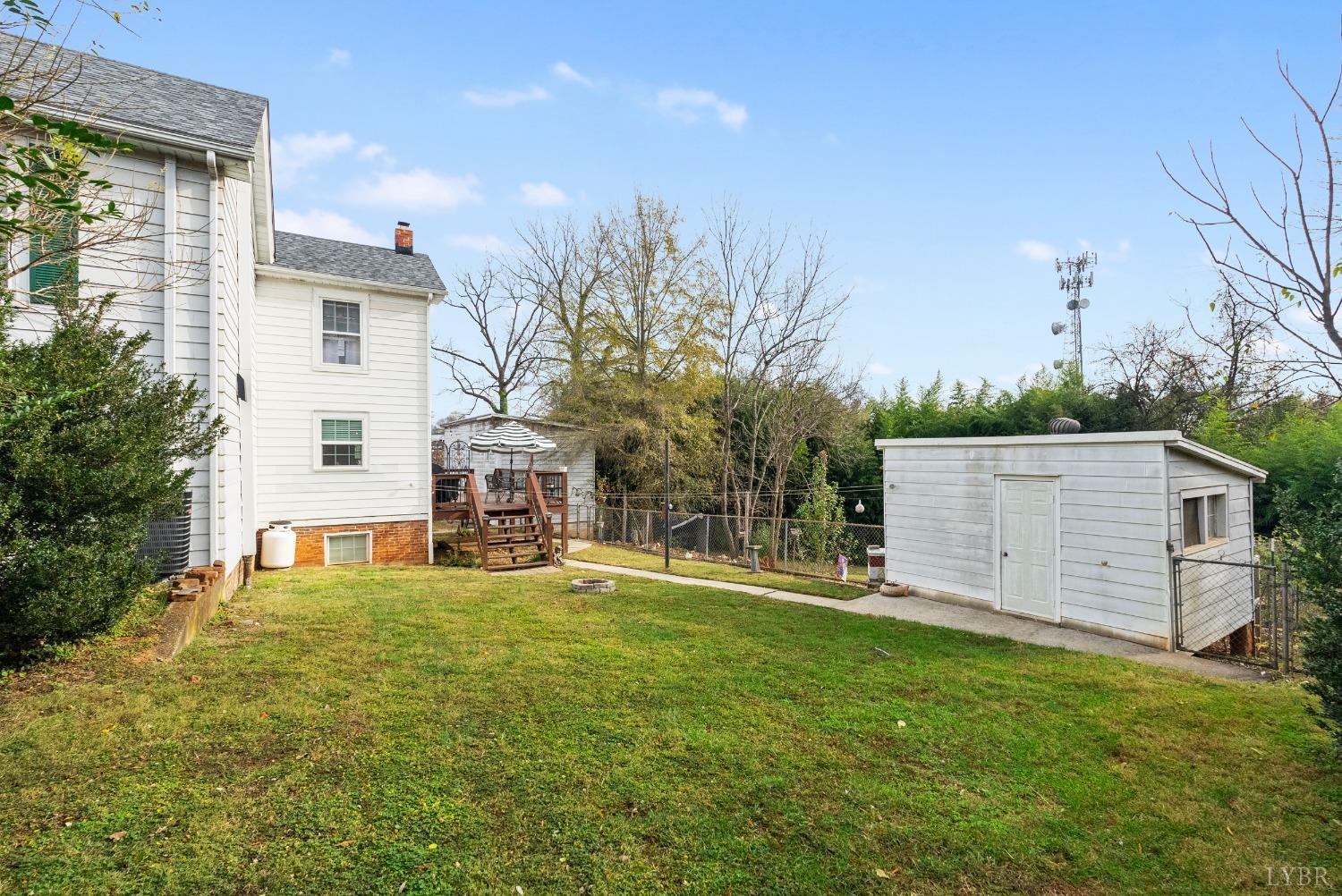 243 South Main Street Amherst, VA 24521 - Photo 50 of 57 a view of a house with a yard and sitting area