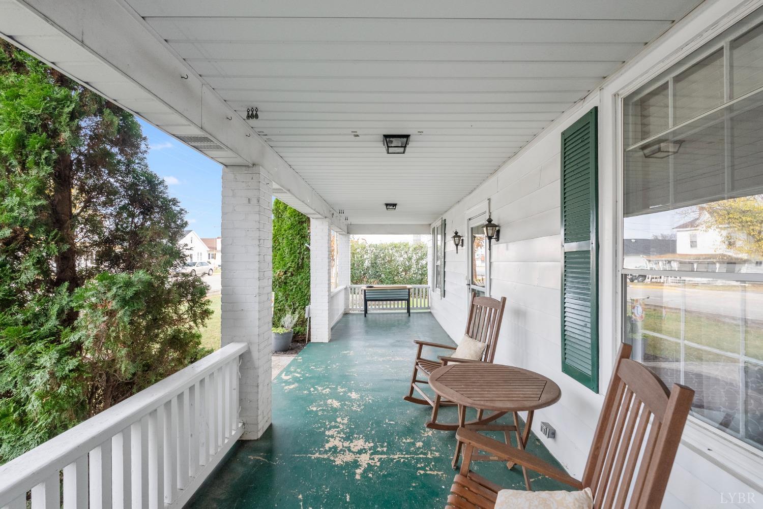 243 South Main Street Amherst, VA 24521 - Photo 5 of 57 a view of a porch with furniture and a yard