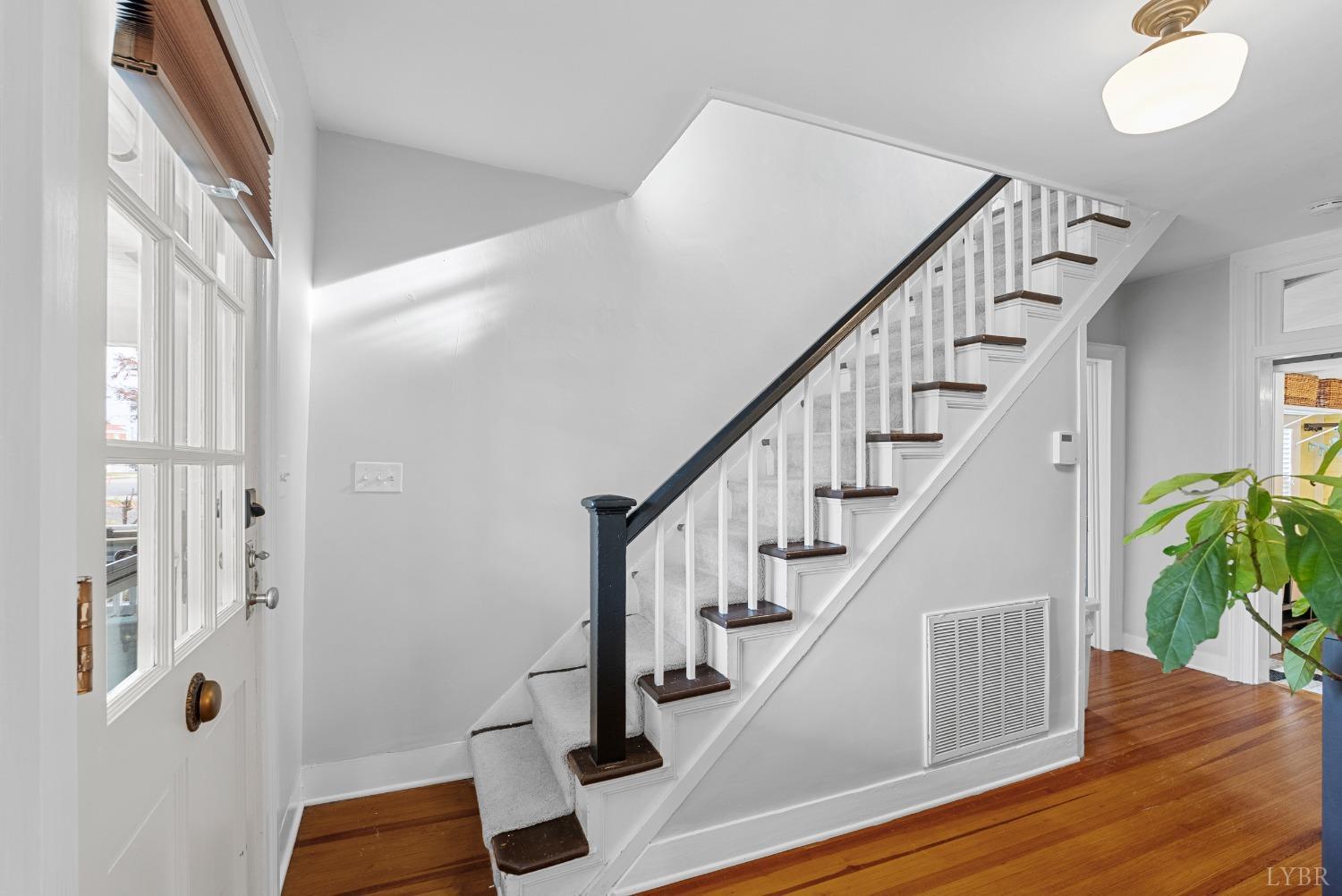 243 South Main Street Amherst, VA 24521 - Photo 8 of 57 a view of entryway with wooden floor and stairs