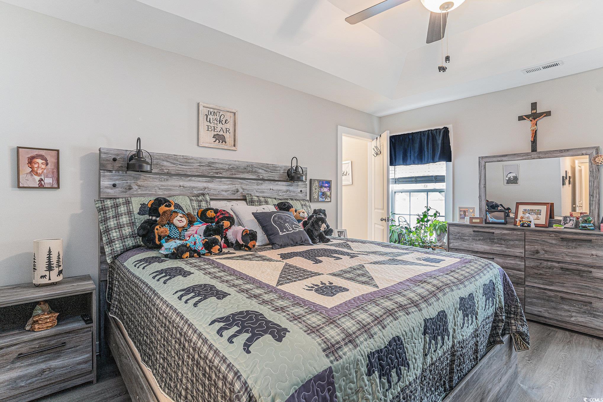 2602 Floribunda Lane Conway, SC 29527 - Photo 10 of 28 Bedroom with wood finished floors, ceiling fan, and a tray ceiling