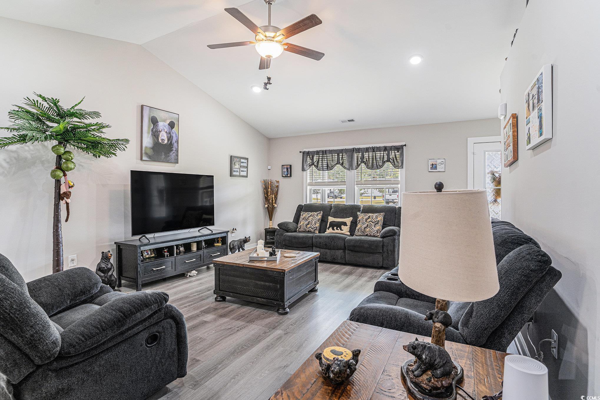 2602 Floribunda Lane Conway, SC 29527 - Photo 3 of 28 Living area with lofted ceiling, wood finished floors, a ceiling fan, and recessed lighting