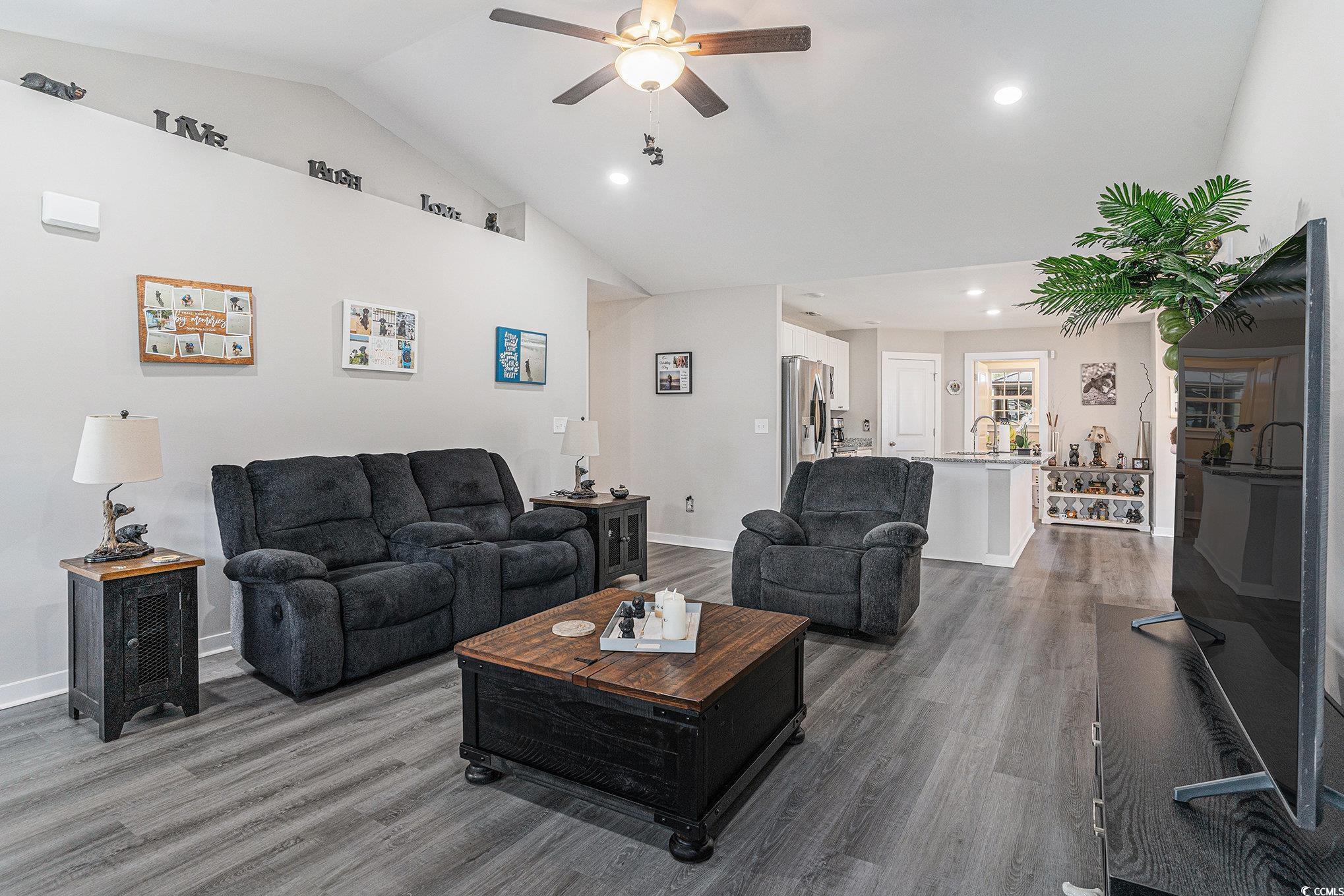 2602 Floribunda Lane Conway, SC 29527 - Photo 5 of 28 Living area featuring dark wood-style flooring, a ceiling fan, recessed lighting, and high vaulted ceiling