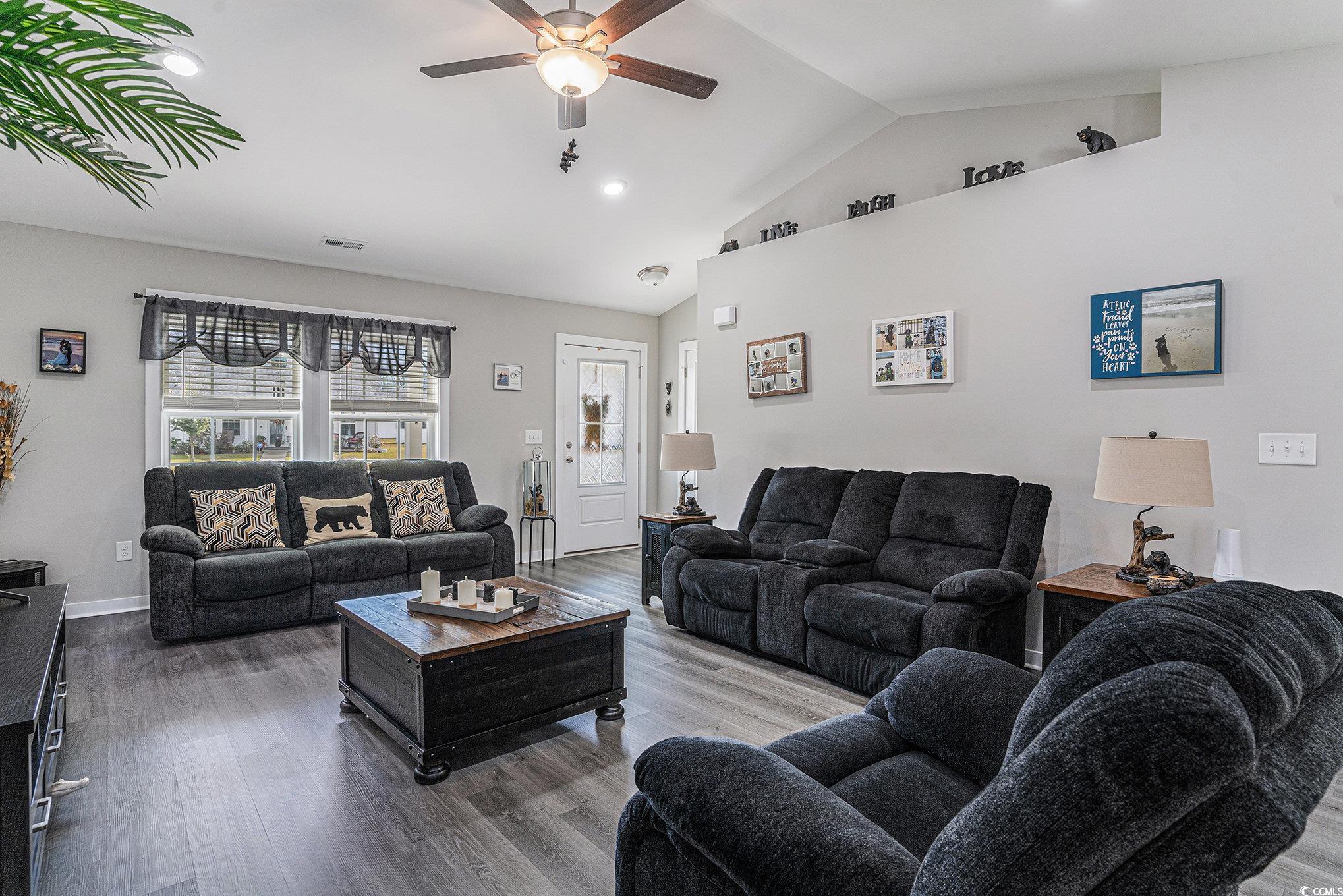 2602 Floribunda Lane Conway, SC 29527 - Photo 6 of 28 Living area featuring lofted ceiling, wood finished floors, recessed lighting, and a ceiling fan
