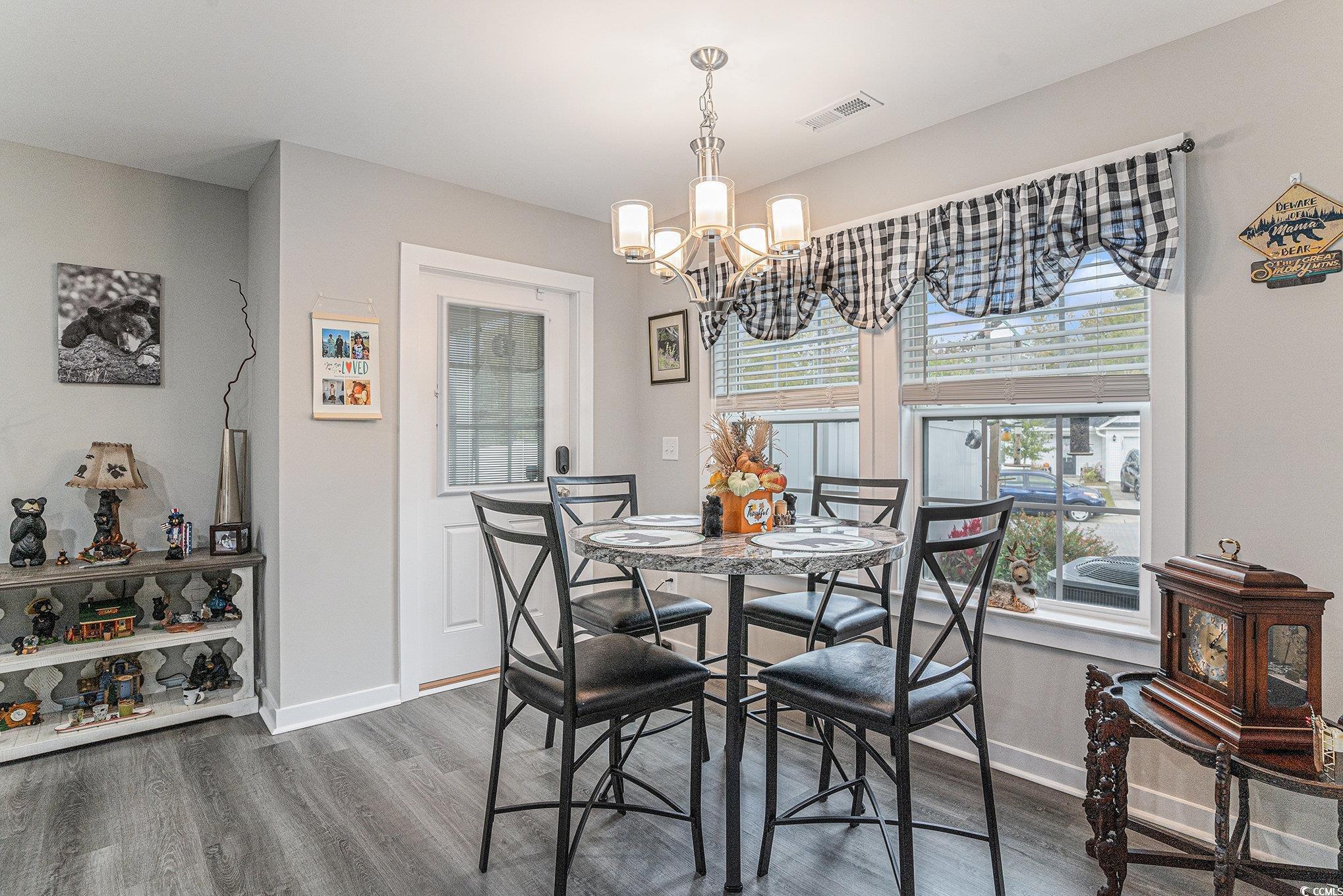 2602 Floribunda Lane Conway, SC 29527 - Photo 9 of 28 Dining room with wood finished floors and a chandelier