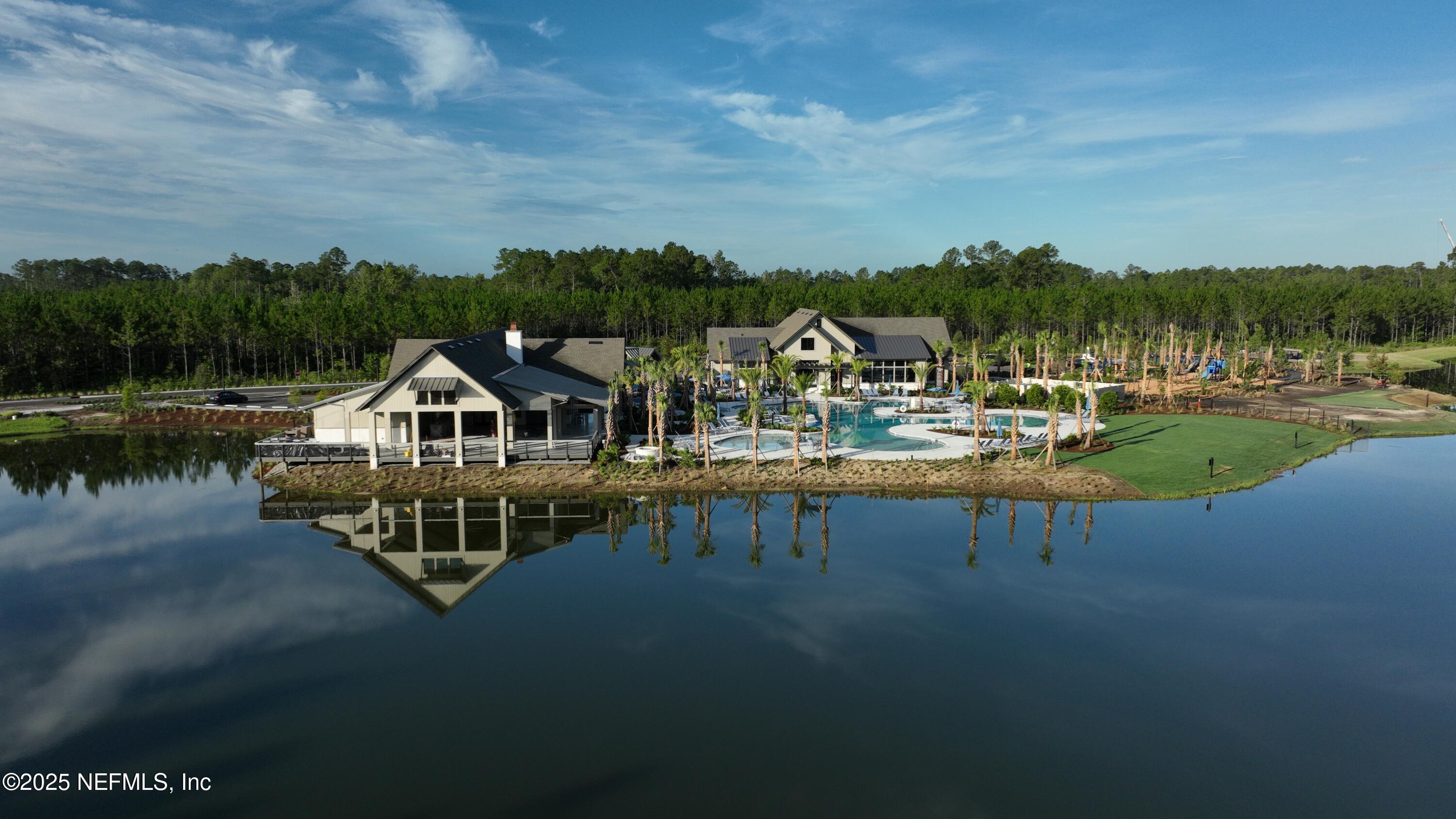 76104 Estuary Way Yulee, FL 32097 - Photo 25 of 41 a house with river in front of it