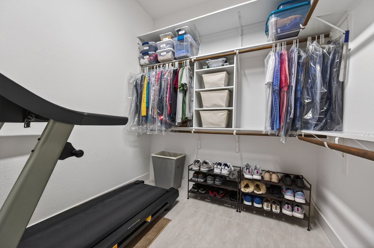 16707 Seminole Ridge Drive Cypress, TX 77433 - Photo 15 of 26 a view of walk in closet with clothes and shoes