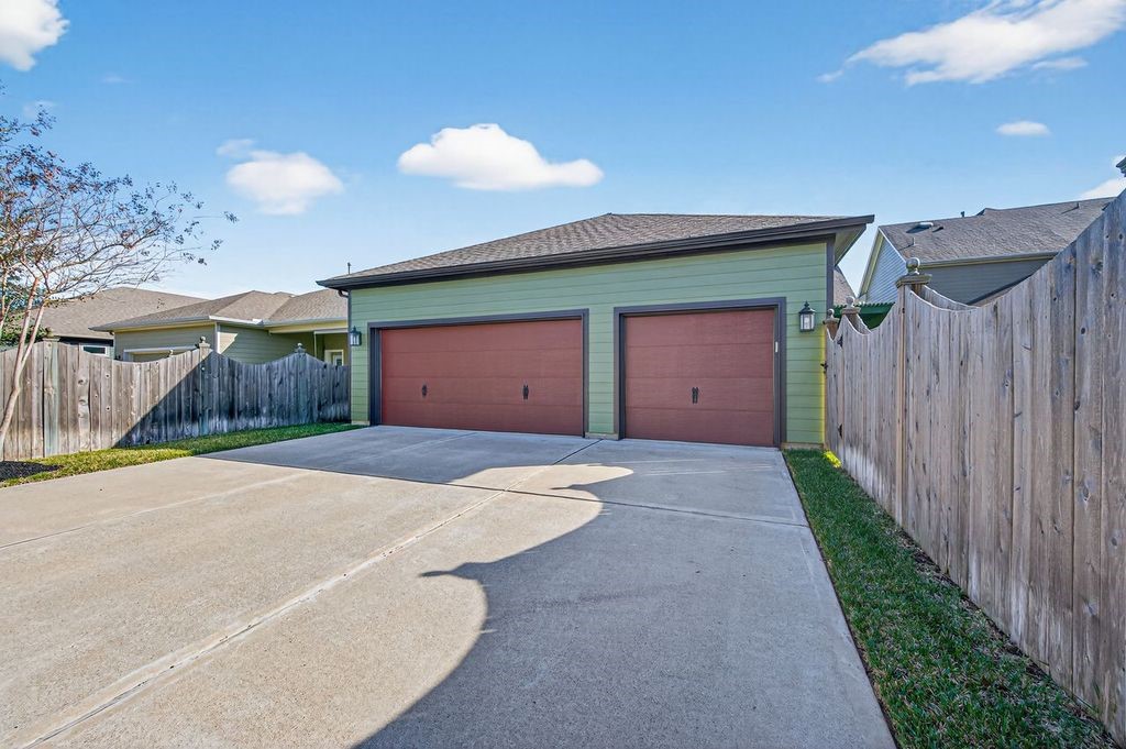 16707 Seminole Ridge Drive Cypress, TX 77433 - Photo 25 of 26 a front view of a house with a yard and garage