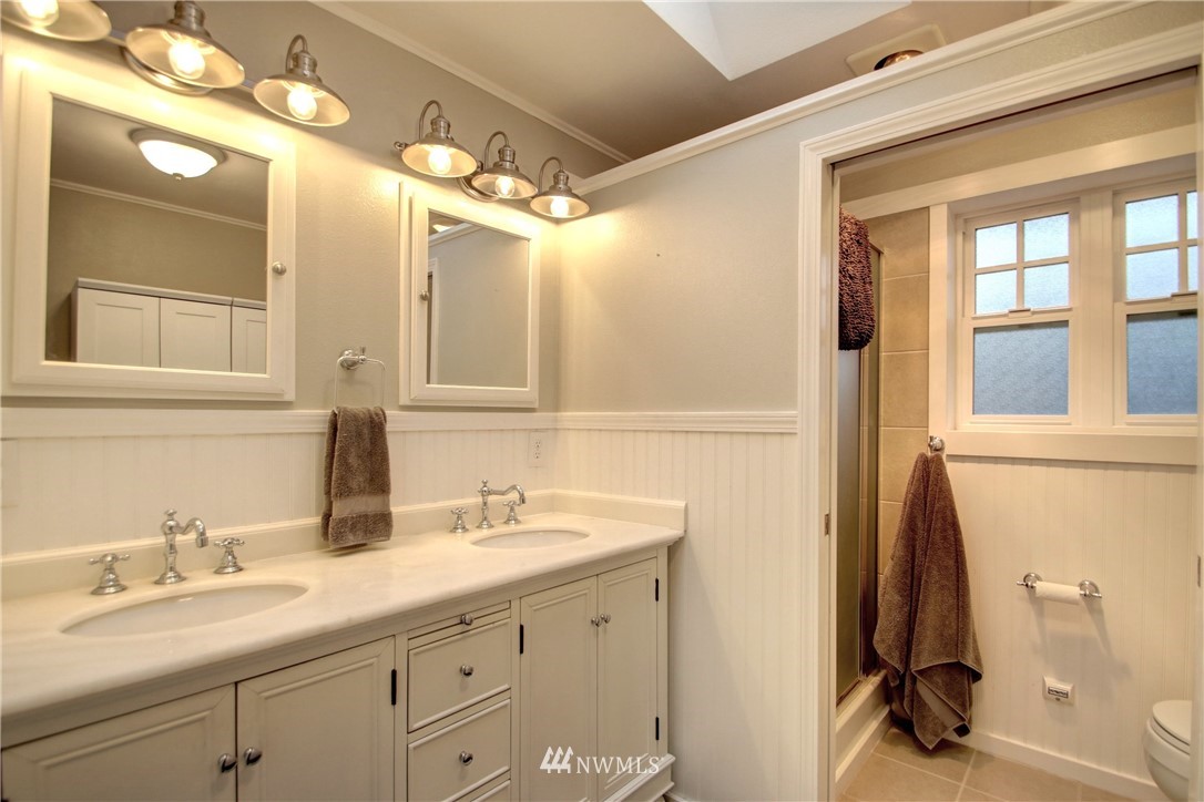 12814 Farm To Market Road Mount Vernon, WA 98273 - Photo 18 of 32 a bathroom with a double vanity sink and a mirror