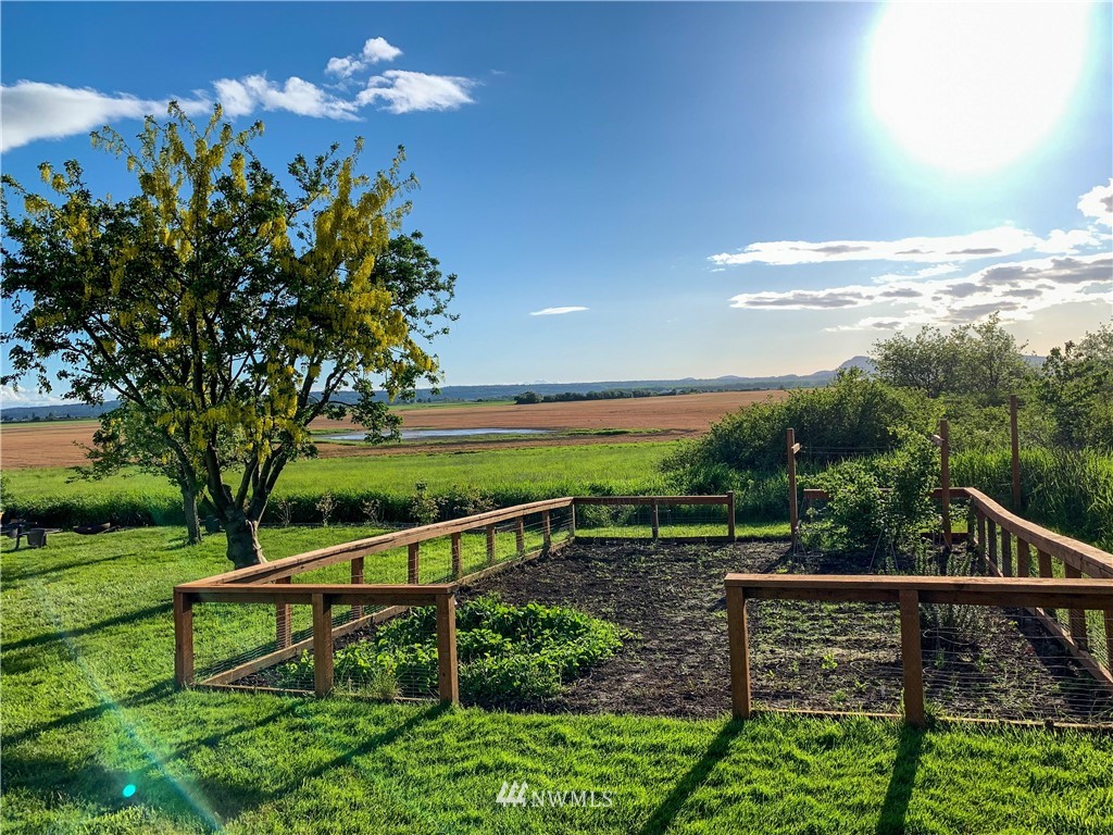 12814 Farm To Market Road Mount Vernon, WA 98273 - Photo 24 of 32 a view of a lake with a garden