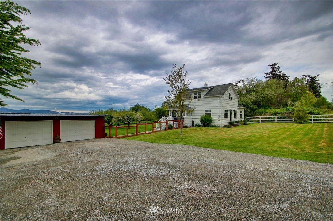 12814 Farm To Market Road Mount Vernon, WA 98273 - Photo 26 of 32 a house view with a garden space