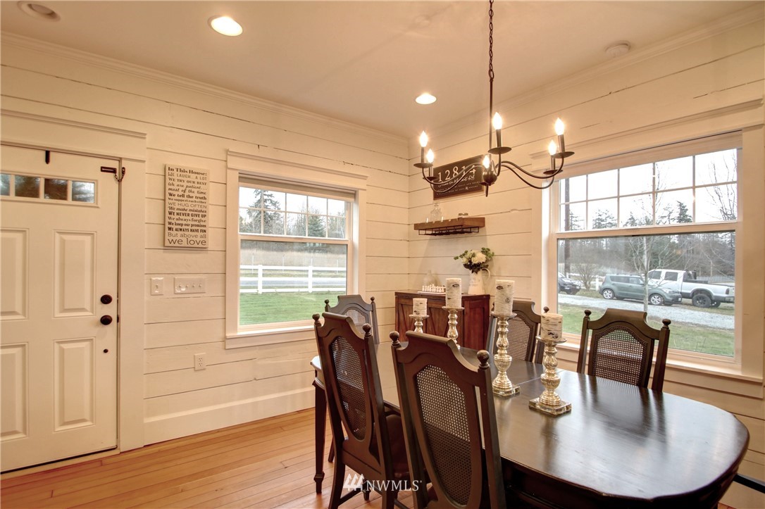 12814 Farm To Market Road Mount Vernon, WA 98273 - Photo 6 of 32 a view of a dining room with furniture window and wooden floor