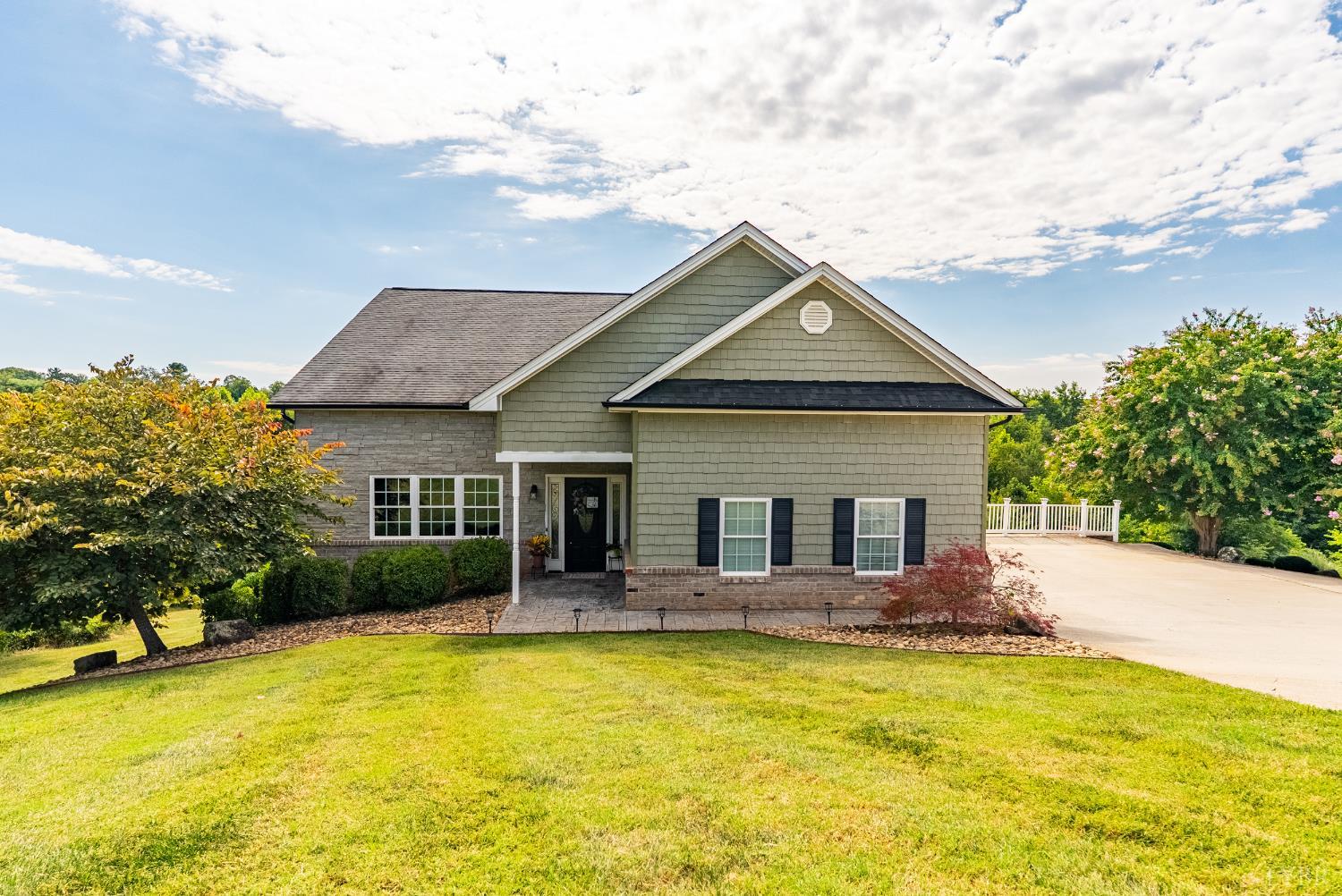 a front view of house with swimming pool and porch