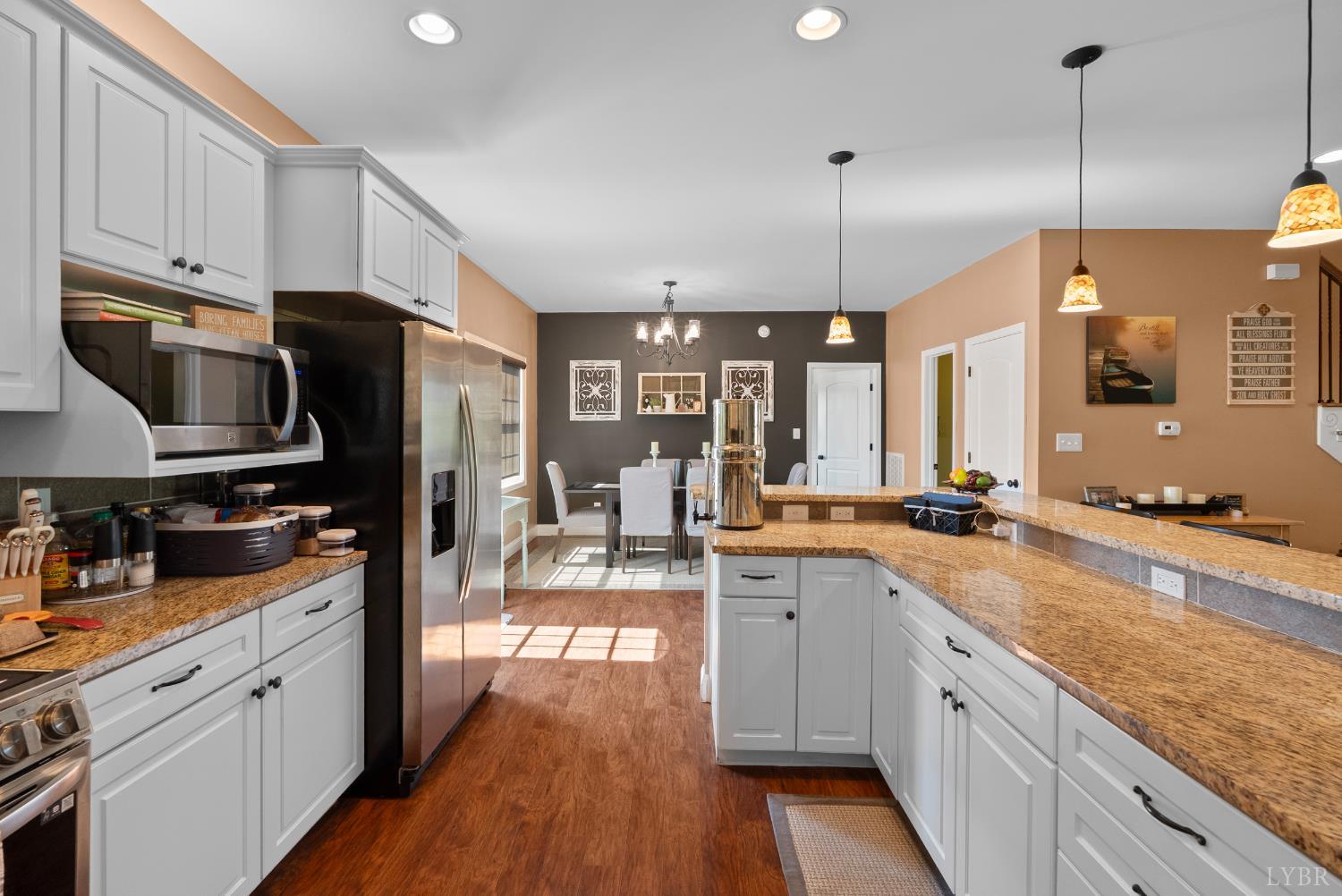 106 Nettie Court Lynchburg, VA 24502 - Photo 11 of 55 a large kitchen with stainless steel appliances kitchen island granite countertop a sink a stove and cabinets