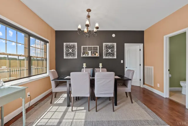 a bathroom with a sink mirror and toilet
