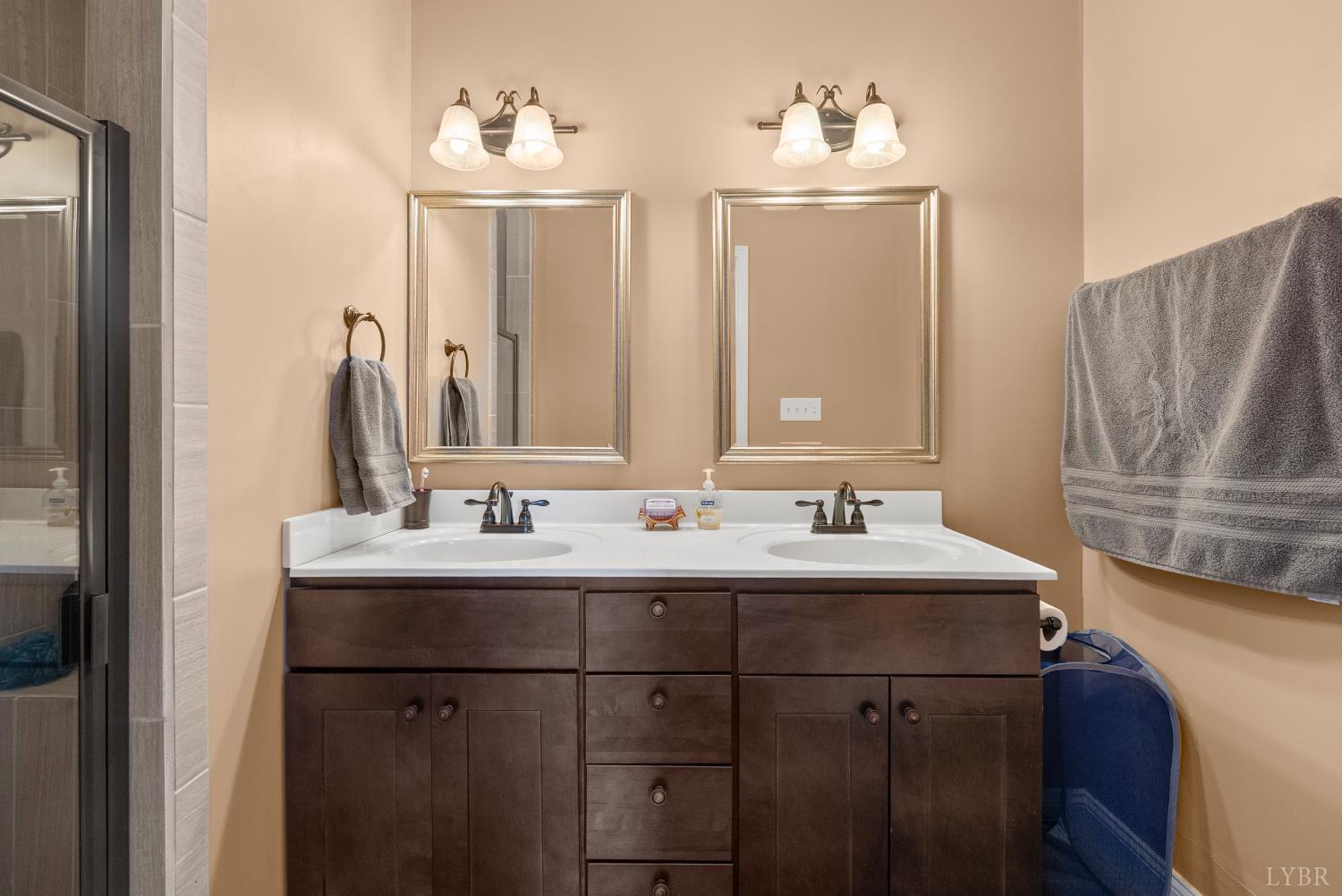 106 Nettie Court Lynchburg, VA 24502 - Photo 17 of 55 a bathroom with a double vanity sink and a mirror