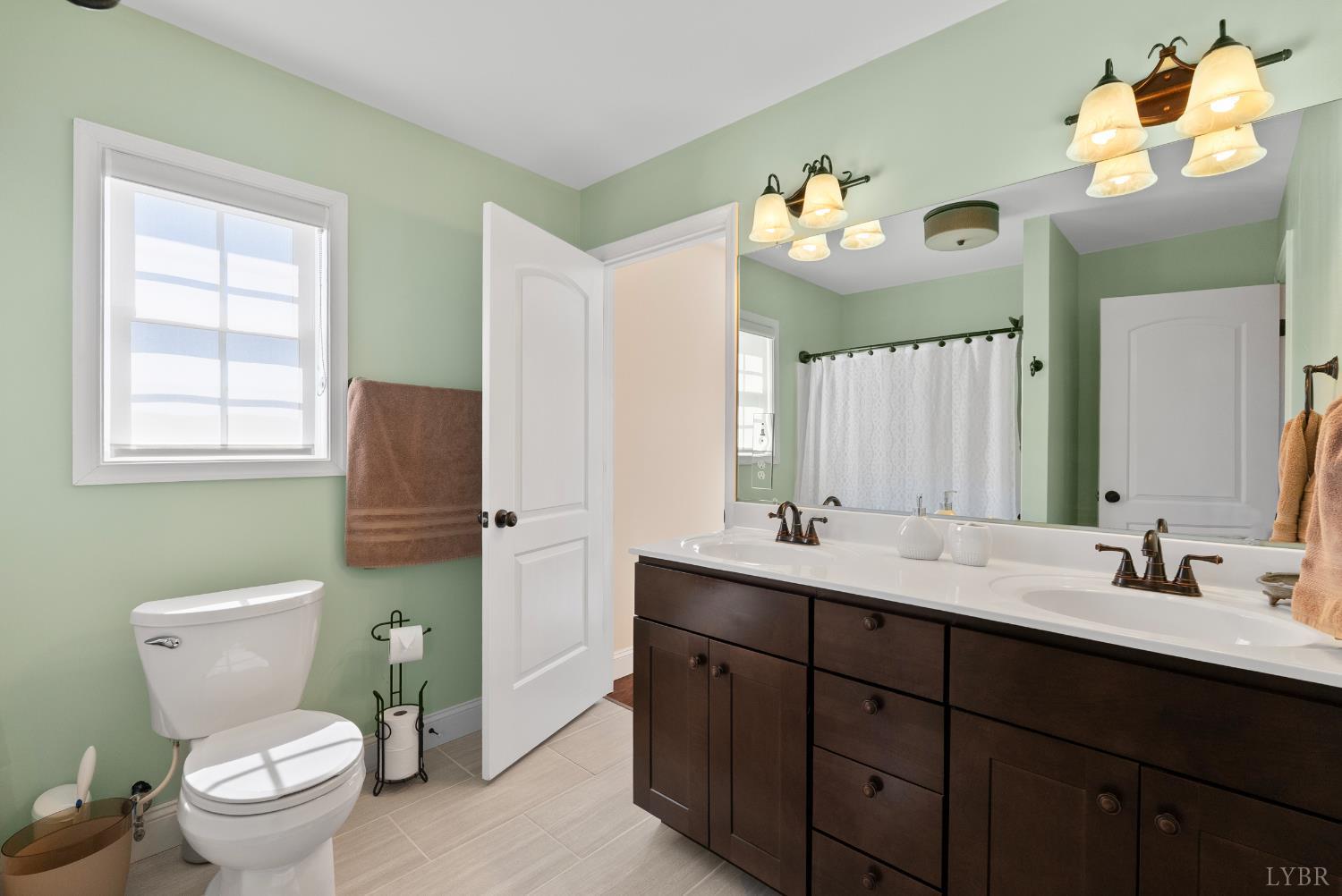 106 Nettie Court Lynchburg, VA 24502 - Photo 21 of 55 a bathroom with a toilet sink and mirror