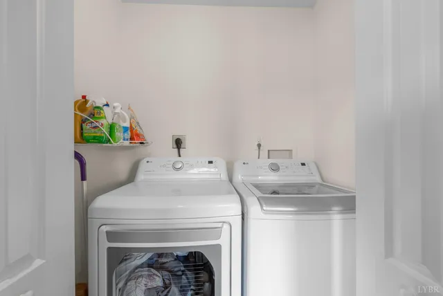 a bedroom with furniture and a large window