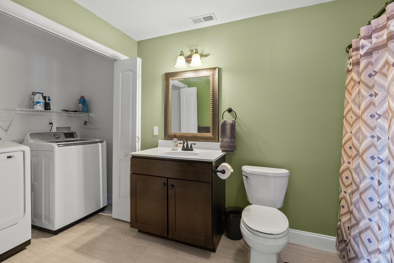 106 Nettie Court Lynchburg, VA 24502 - Photo 35 of 55 a bathroom with a toilet sink and mirror