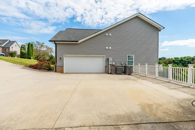 a view of a swimming pool with an outdoor seating and a yard