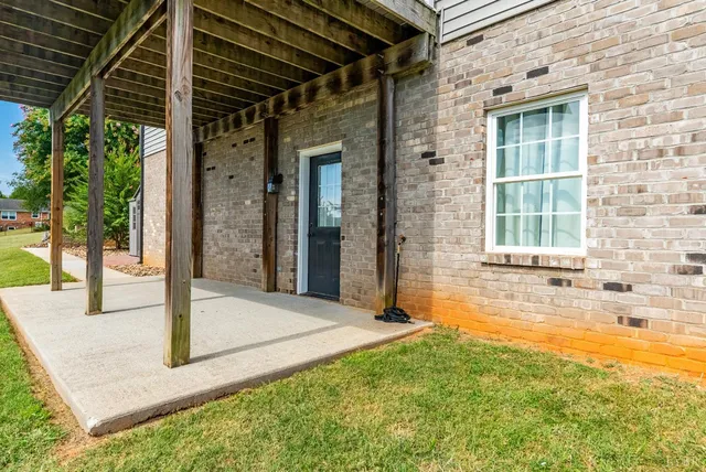 a view of a swimming pool with an outdoor space and seating area