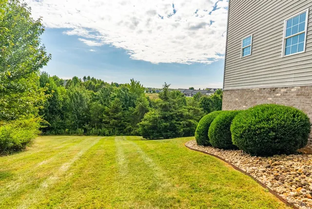 a view of a balcony with wooden floor and outdoor seating