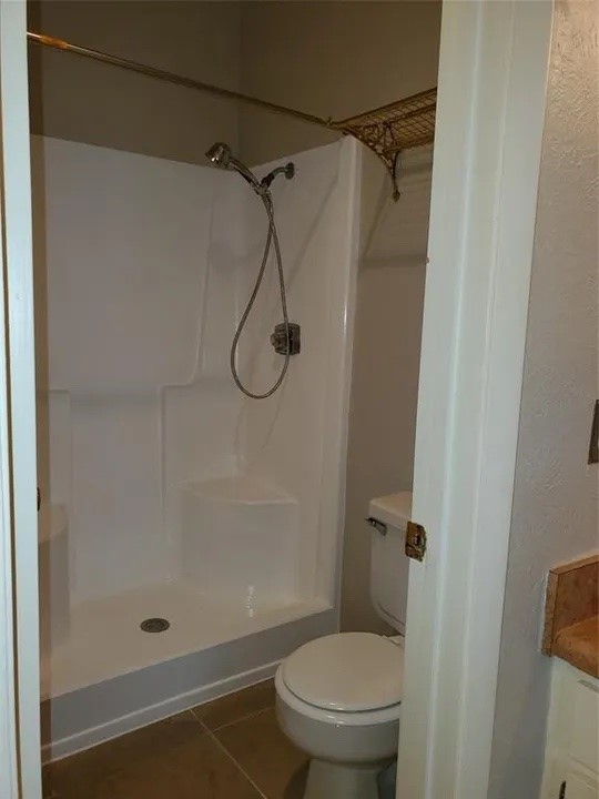 5000 Milwee Street, Unit 44 Houston, TX 77092 - Photo 13 of 16 a bathroom with a shower and a toilet