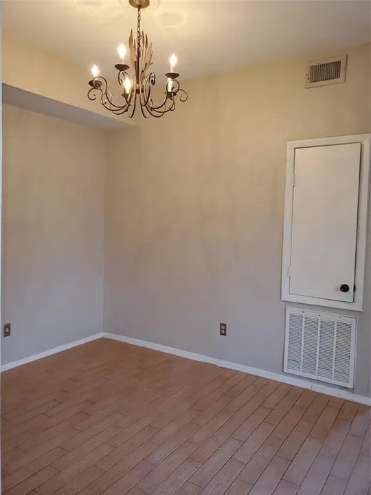 5000 Milwee Street, Unit 44 Houston, TX 77092 - Photo 5 of 16 a view of a room with wooden floor and ceiling fan