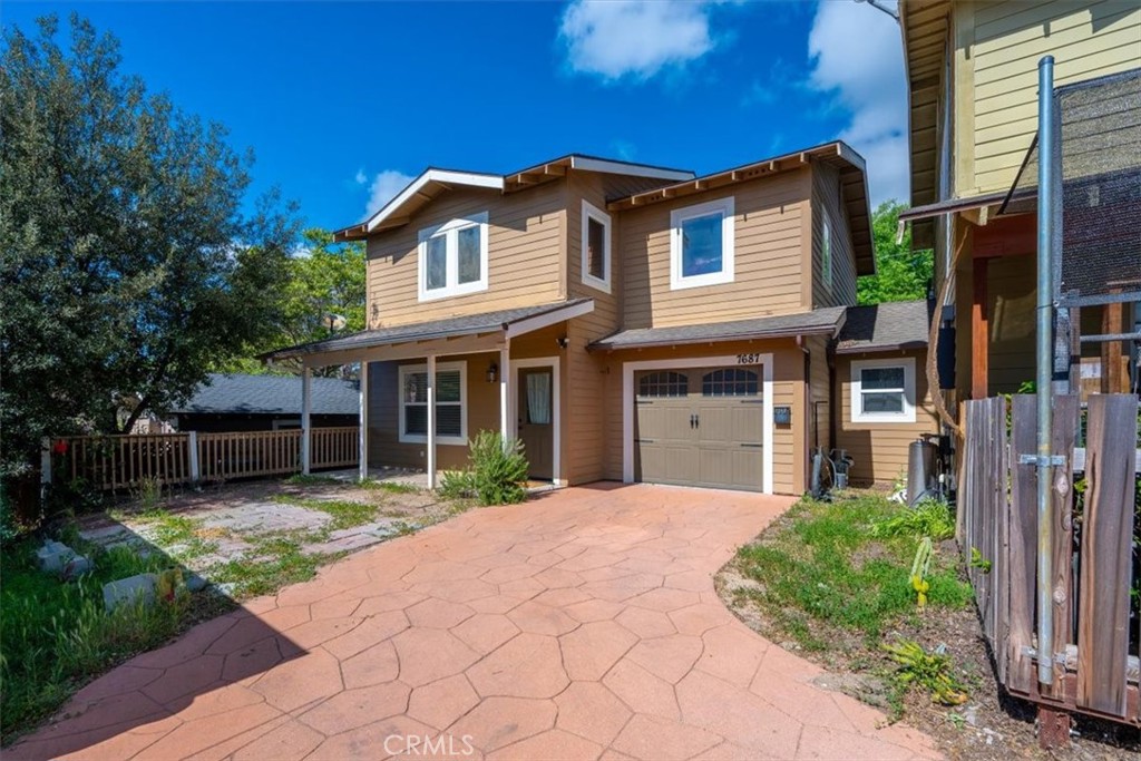 7687 Sinaloa Avenue Atascadero, CA 93422 - Photo 1 of 34 a front view of a house with garden