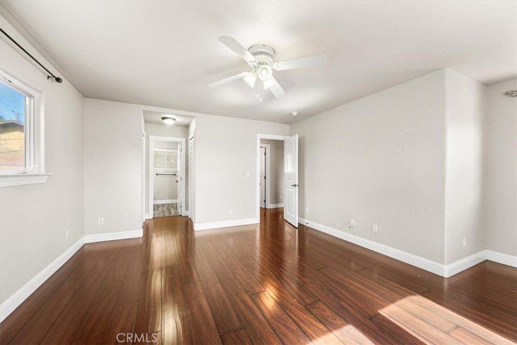 7687 Sinaloa Avenue Atascadero, CA 93422 - Photo 16 of 34 a view of an empty room with wooden floor and a window