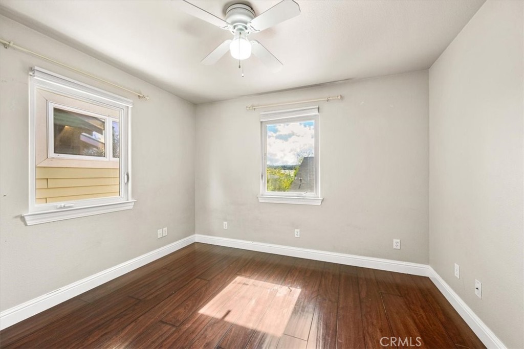 7687 Sinaloa Avenue Atascadero, CA 93422 - Photo 20 of 34 a view of an empty room with wooden floor and a window