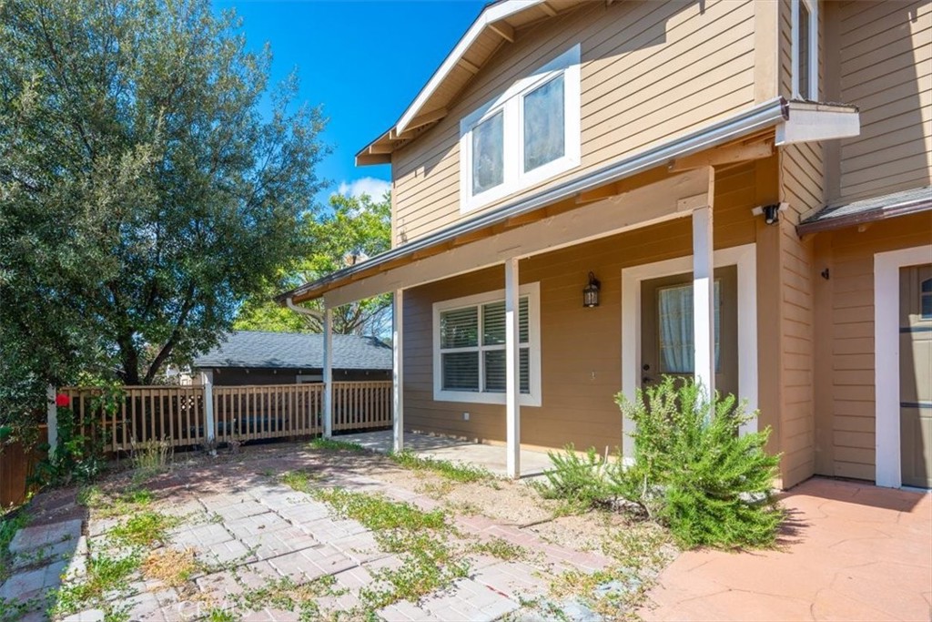 7687 Sinaloa Avenue Atascadero, CA 93422 - Photo 3 of 34 a view of a house with a yard and chair