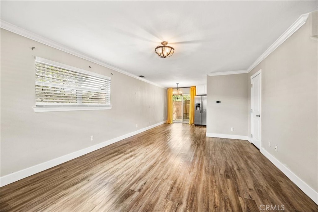 7687 Sinaloa Avenue Atascadero, CA 93422 - Photo 7 of 34 a view of an empty room with wooden floor and a window