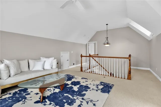 a living room with furniture or couch and a rug